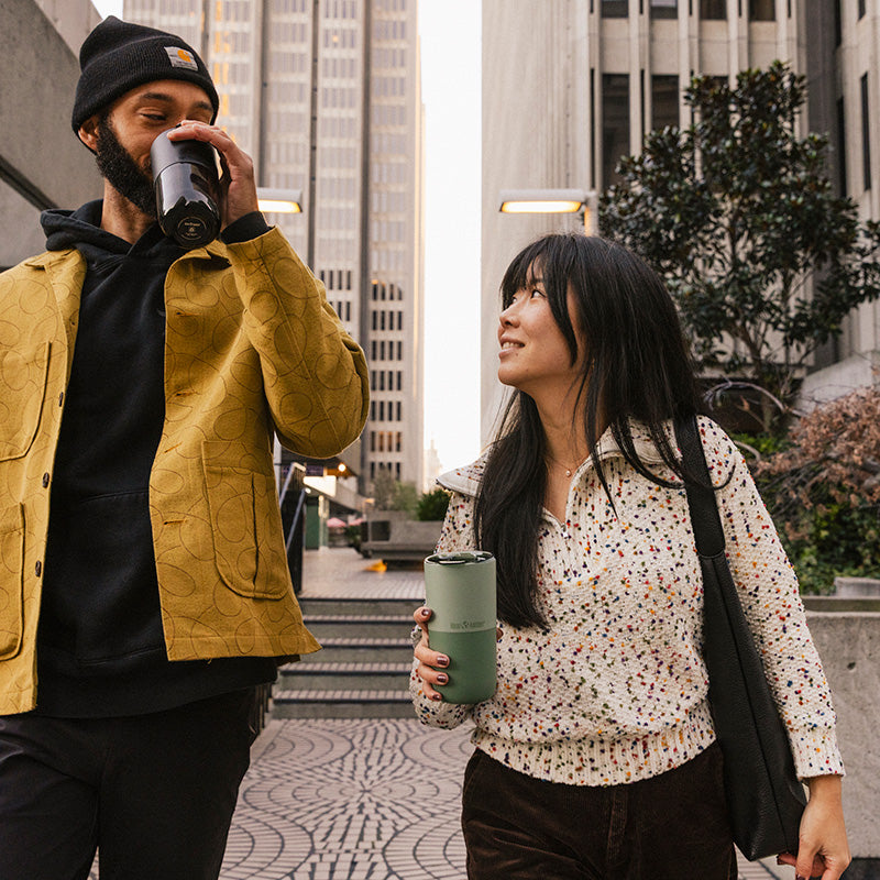 16oz-rise-tumbler-j8 16oz_rise_tumbler_black_iceberg_couple_drink_city_street_square.jpg