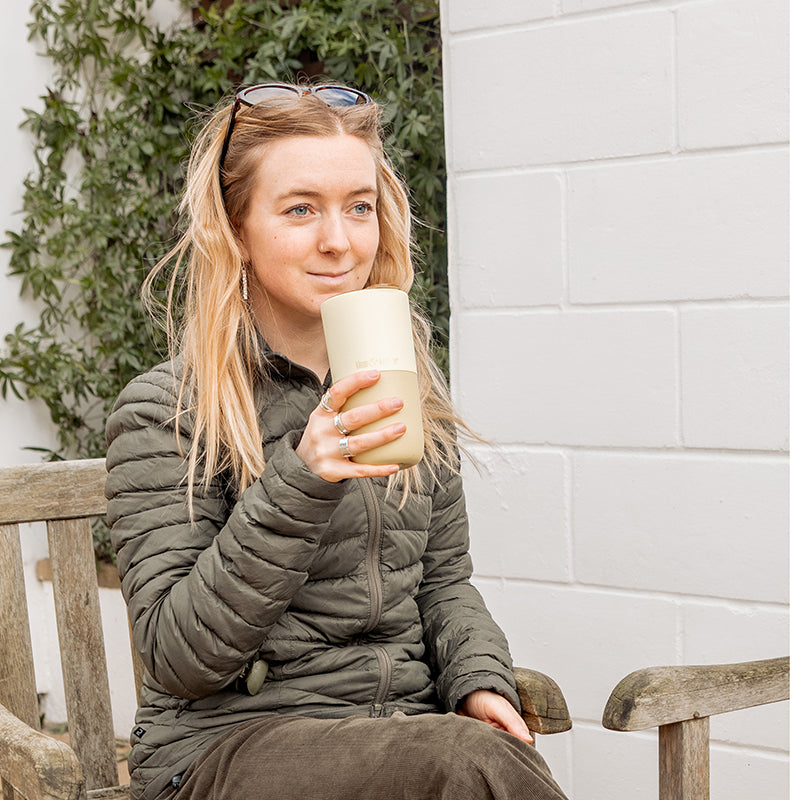 16oz-rise-tumbler-j8 16oz_rise_tumbler_wax_yellow_woman_seat_outside_square.jpg