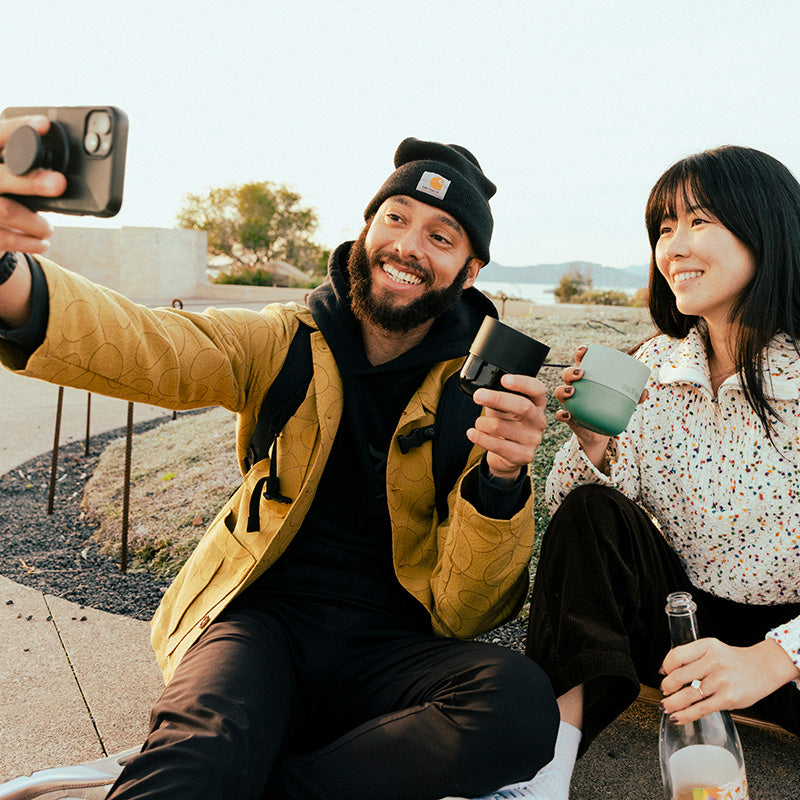 bring-your-own-party-kit-tumblers-and-cocktails-c6 8oz_rise_lowball_black_iceberg_couple_selfie_city_square.jpg