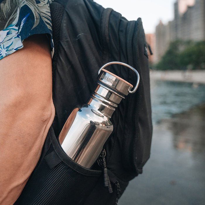 27oz-reflect-with-bamboo-cap-q1 K27SSLRF-MS-BAMBOO_reflect-bottle_backpack_lifestyle.jpg
